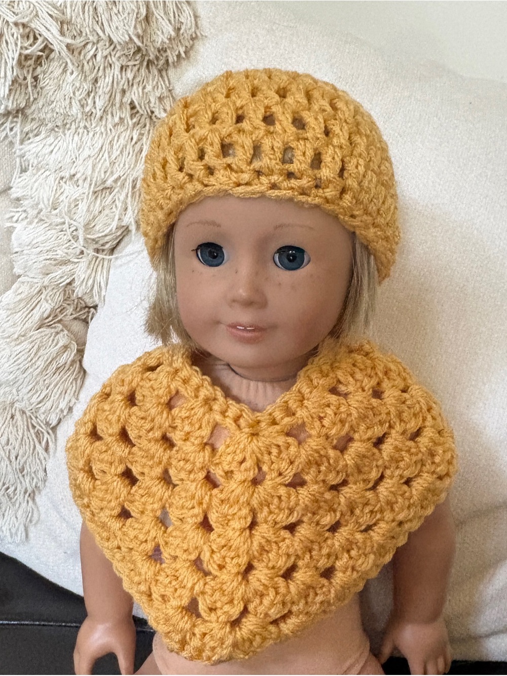 Yellow handmade crochet doll hat and poncho set